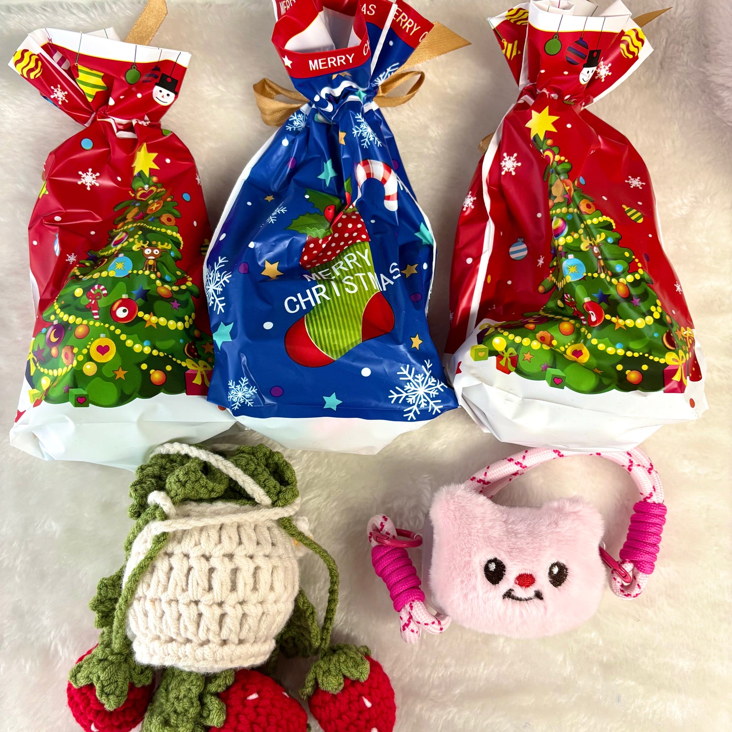 The adorable little items in the Christmas gift box - knitted bags and various phone holders