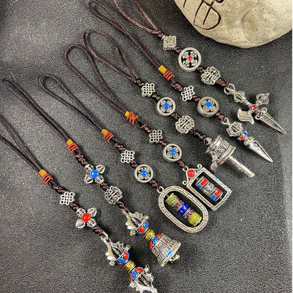 Ethnic-style Tibetan souvenirs: cross-style vajra pendants, small prayer pendants, pendants for carts, and accessories