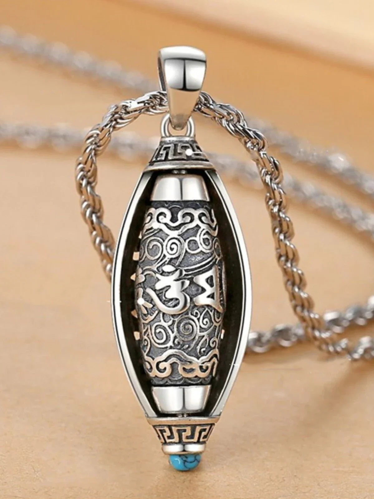 Six-Syllable Mantra Rotating Pendant — product photograph